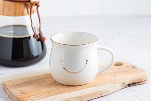 Caneca de café branca e fofa com sorriso dourado e borda curva de Ilseng for Life - xícara de café sorridente para manhãs felizes - China xícara de chá para decoração de prateleira de cozinha - café branco ou xícara de chá - Branco e cinza