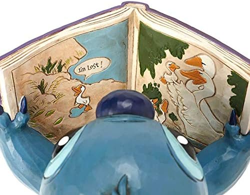 Tradições da Disney de Jim Shore Lilo and Stitch Stitch com um livro de histórias resina de pedra, 5,75
